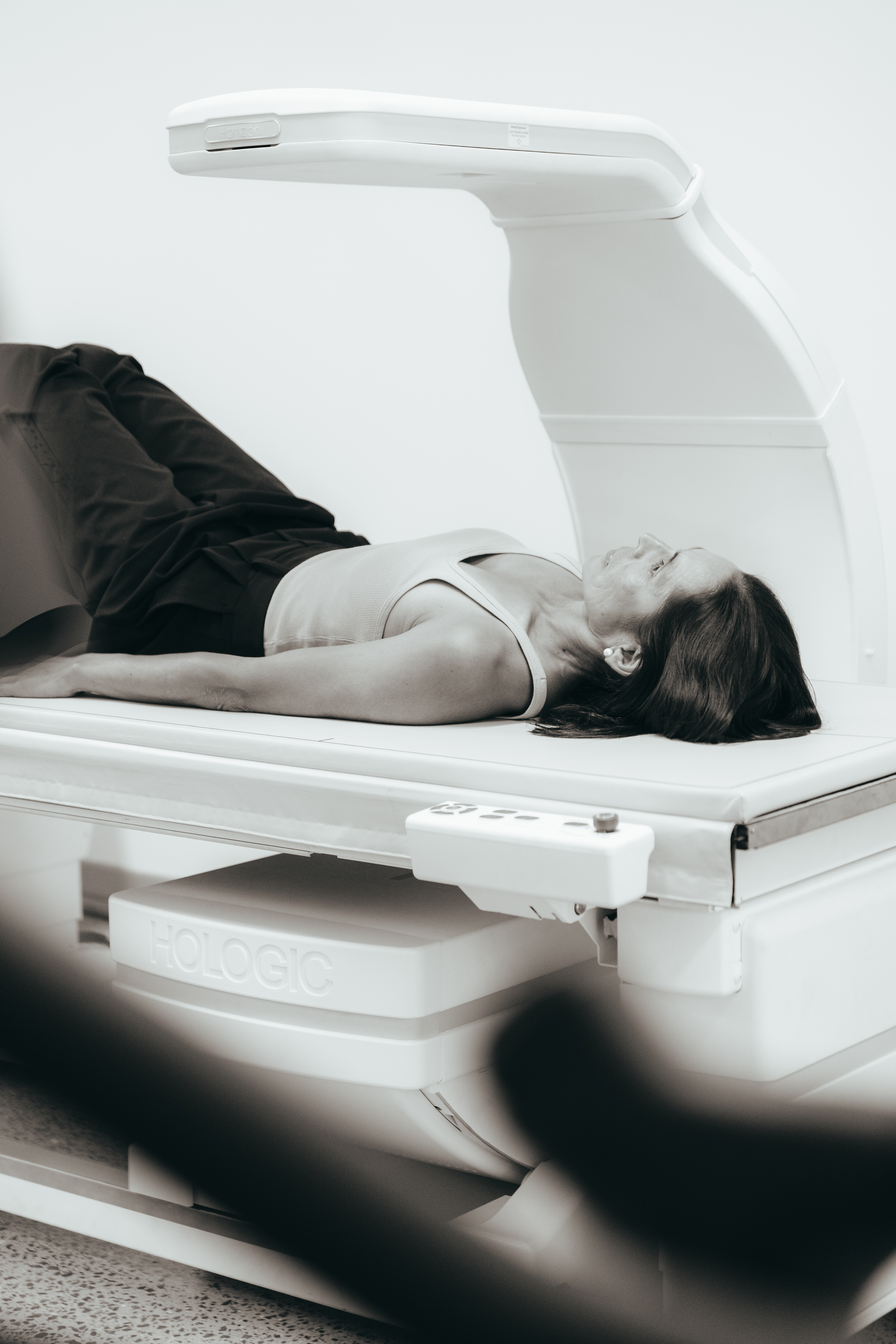 a woman lying on a medical table